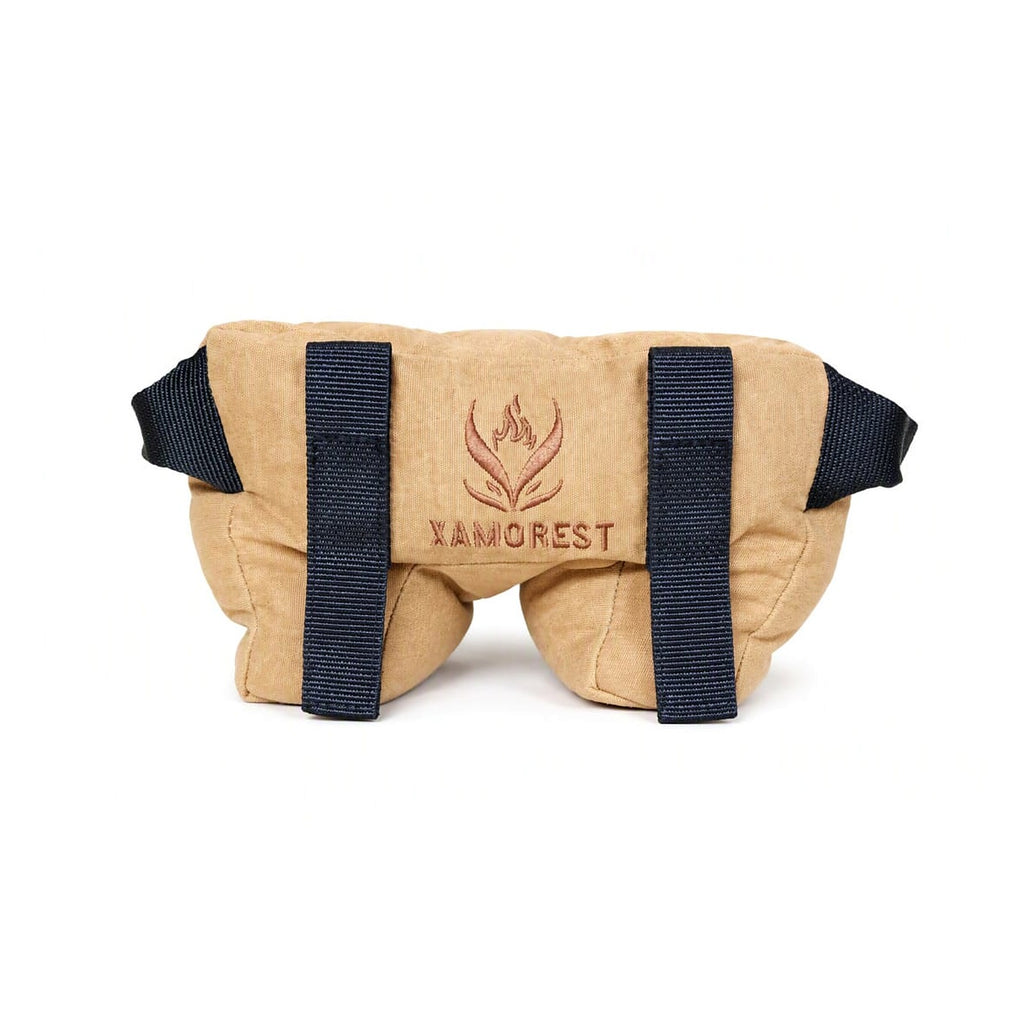 Front of the tan Oxford cloth shooting rest bag with black carry straps